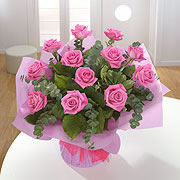 A bouquet of a dozen pink roses,