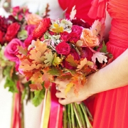 A hand-tied bouquet of red and orange roses